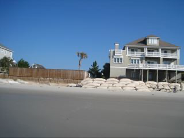 Sandbags lining the front of a beachfront home on Figure Eight Island, NC