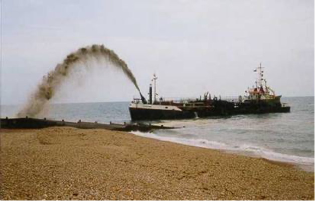 Barge pumping sand back onto the beach from offshore